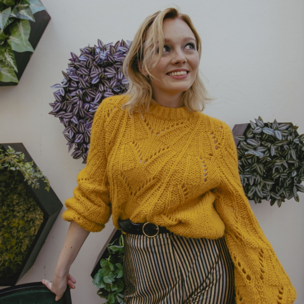 Yellow jumper and gold striped trousers