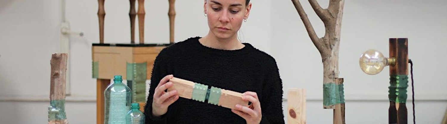 A woman showing the joining bottles technique