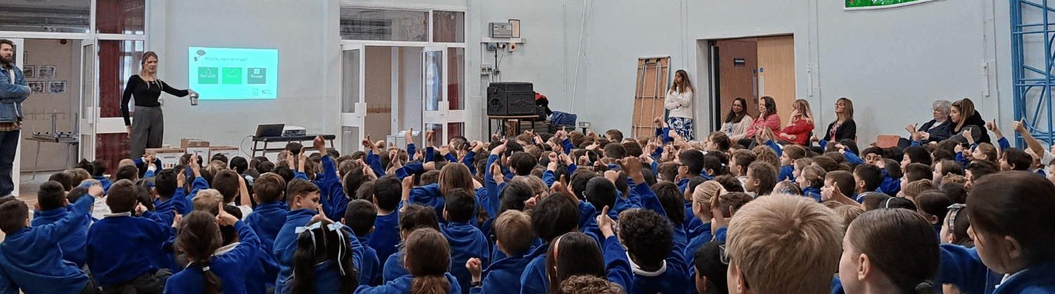 Students in an assembly hall for the In the Know programme