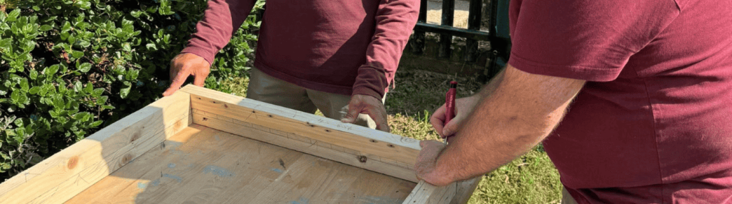 two of the men at work on a wood project at the Men in Sheds venue