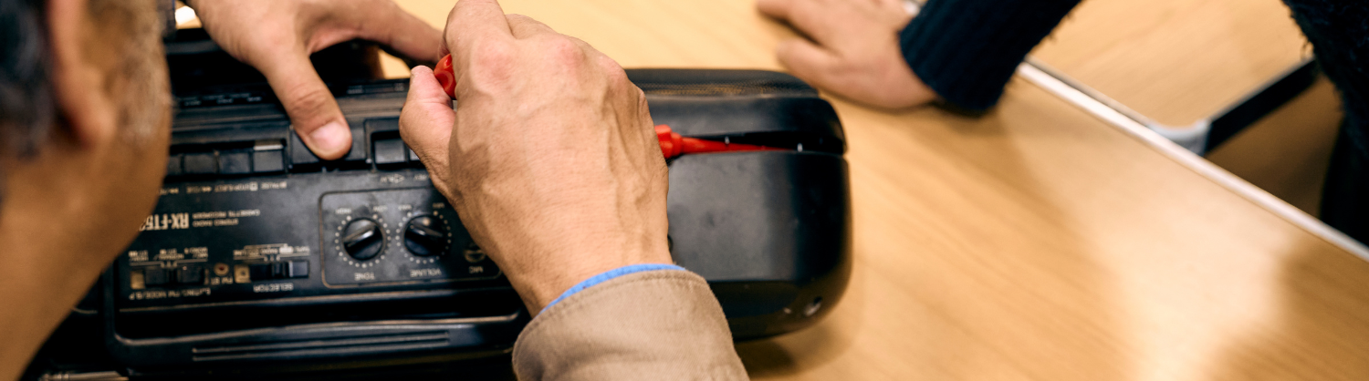 Someone repairing a hi-fi