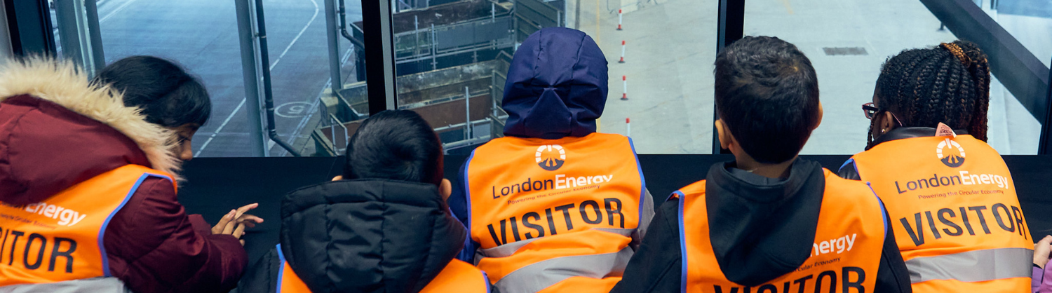 Students wearing high-vis look at the bunker at Edmonton EcoPark