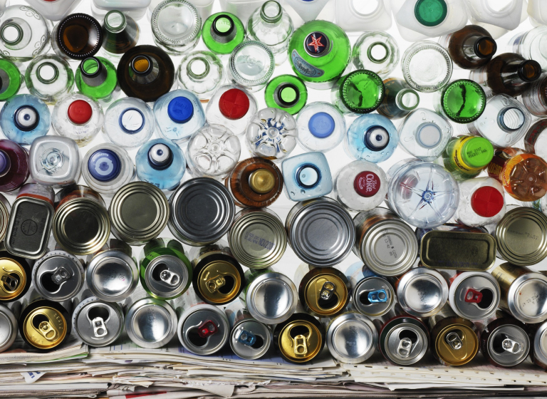 Mixed bottles drinks cans and paper