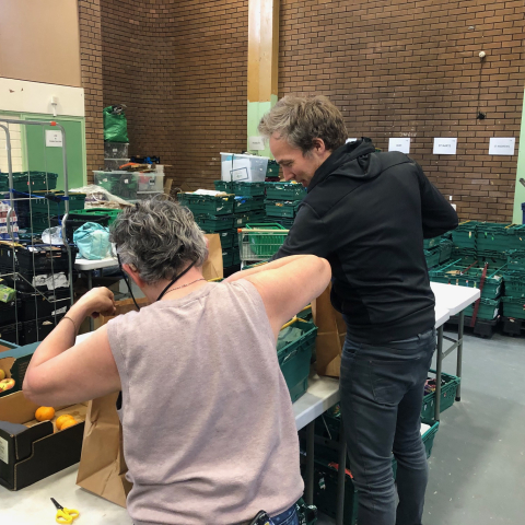 Workers at Hackney Foodbank bagging up groceries