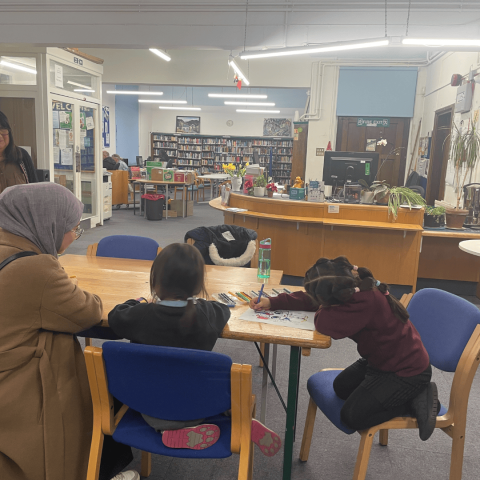 Users of the Friern Barnet Community Library reading books