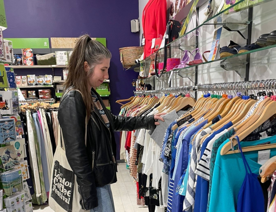 Woman shopping in charity shop