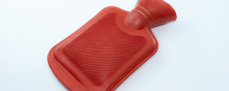 A red rubber hot water bottle