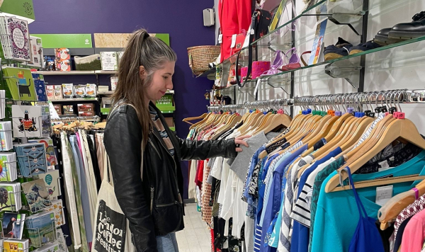 Woman shopping in charity shop