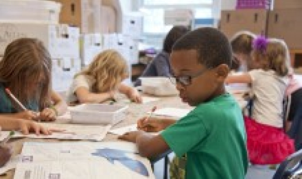 School children working at a table